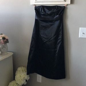 Black satin strapless dress.